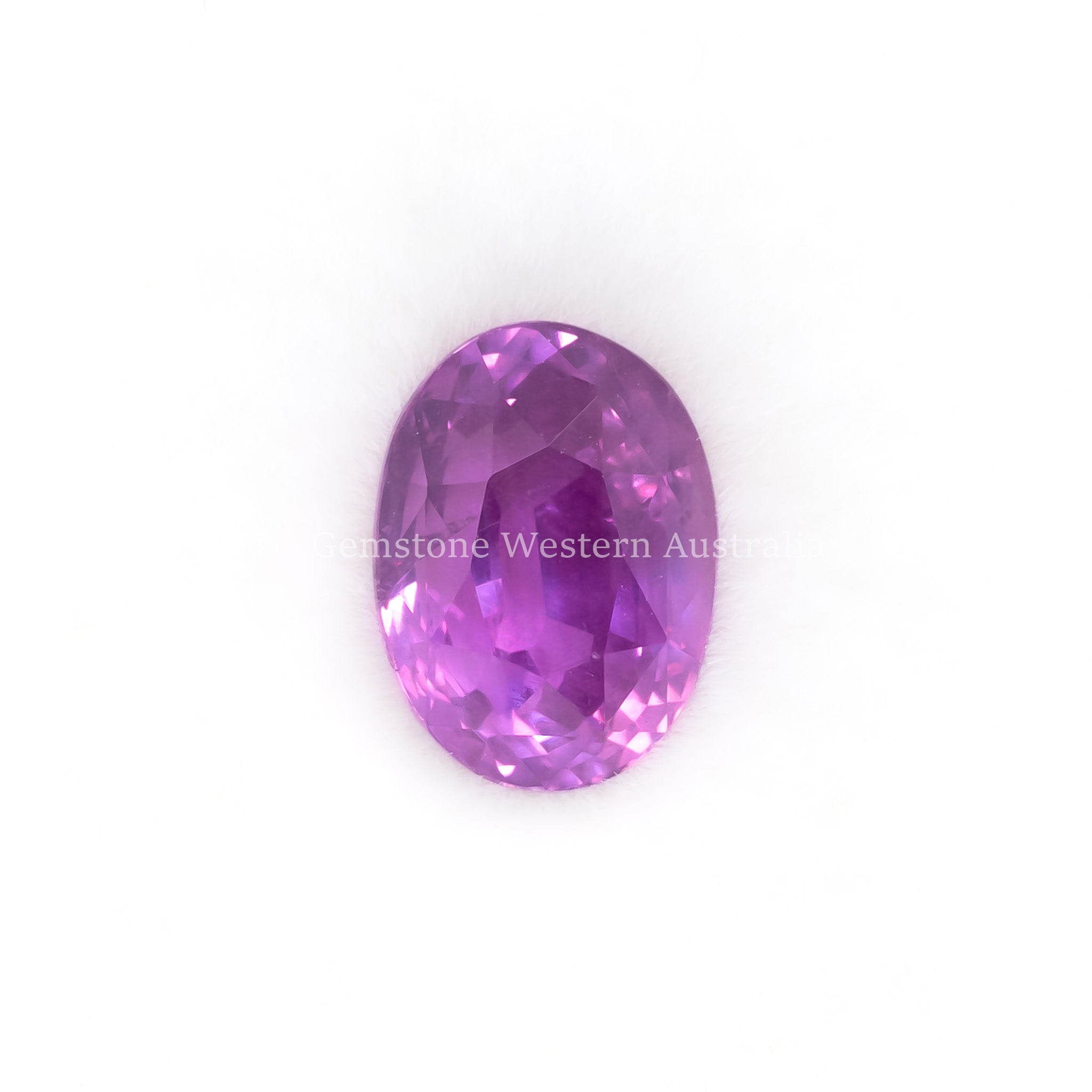 front view of 2.04ct natural unheated pink sapphire in elegant oval cut collector gemstone in white background